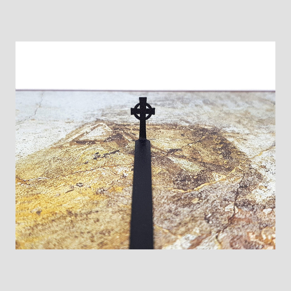 Celtic Cross metal bookmark on a coloured background