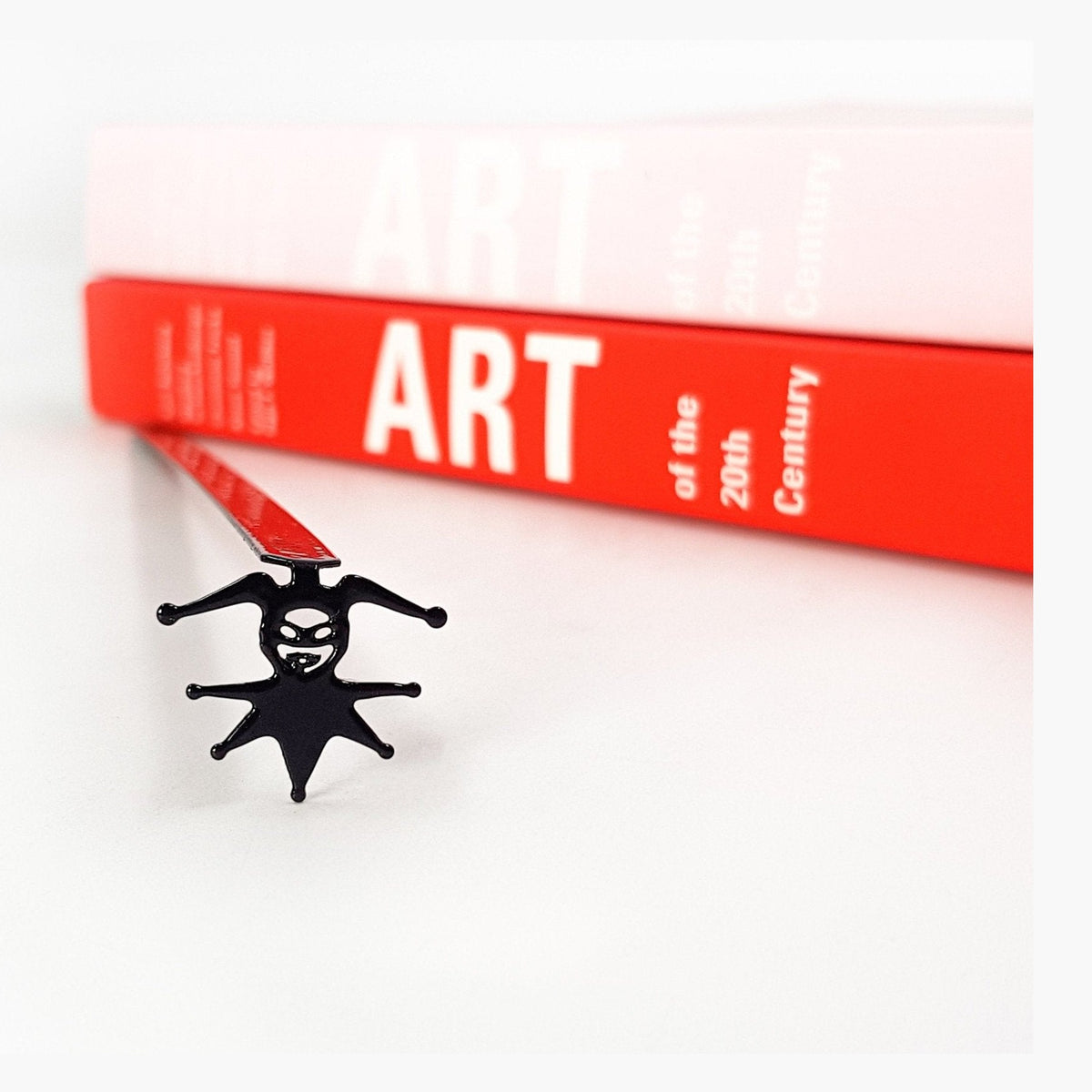 Court Jester metal bookmark on a coloured background