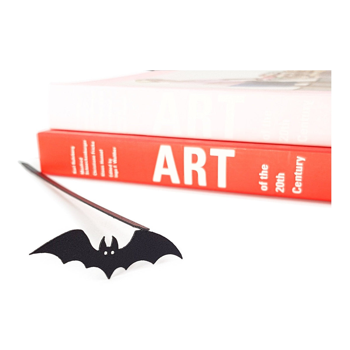 Cryptic Bat metal bookmark on a coloured background