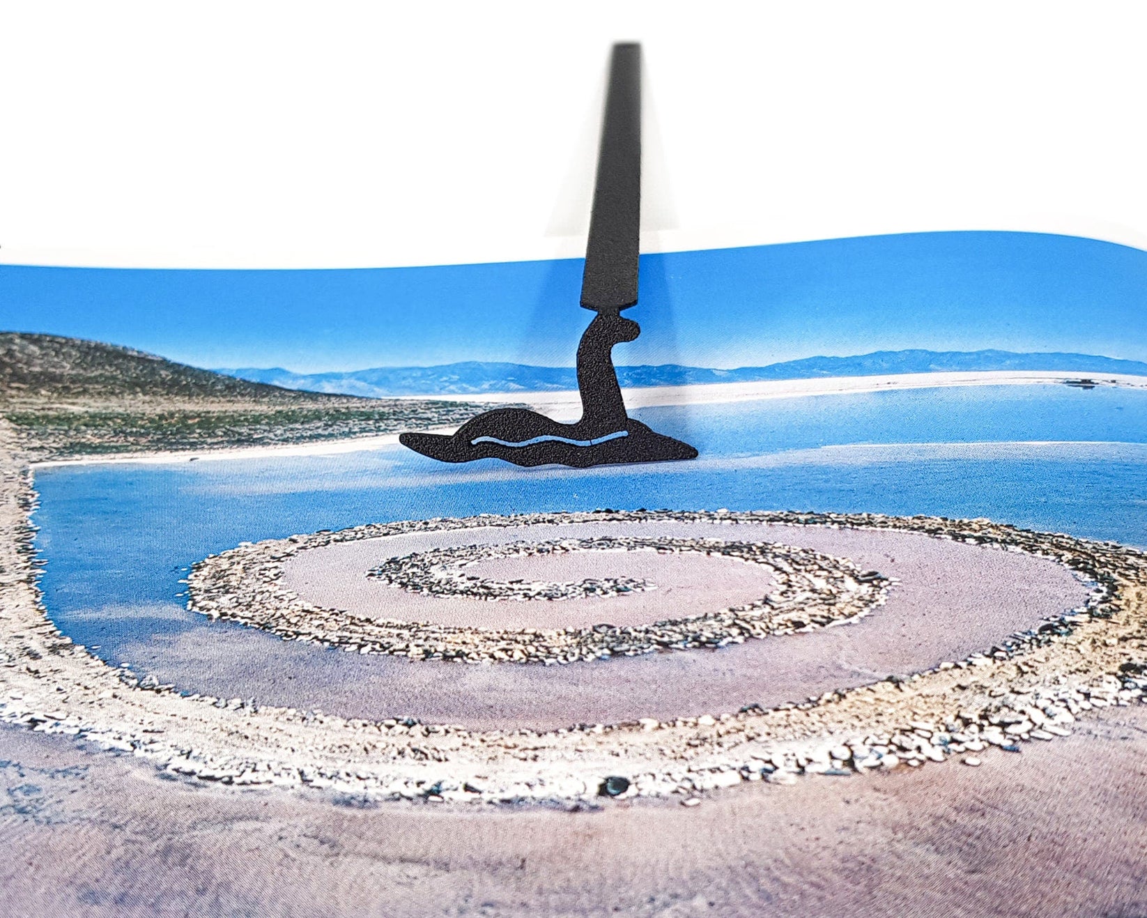 Loch Ness metal bookmark marking a page in an illustrated book