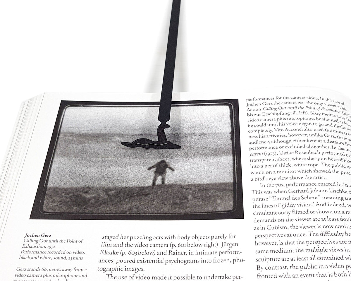 Loch Ness metal bookmark on an illustrated page