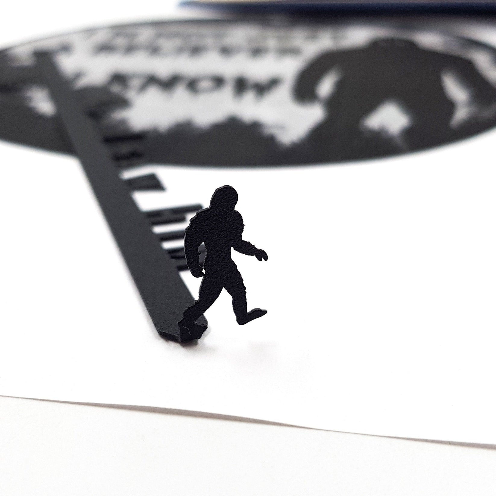Bigfoot metal bookmark close-up of the laser-cut detail