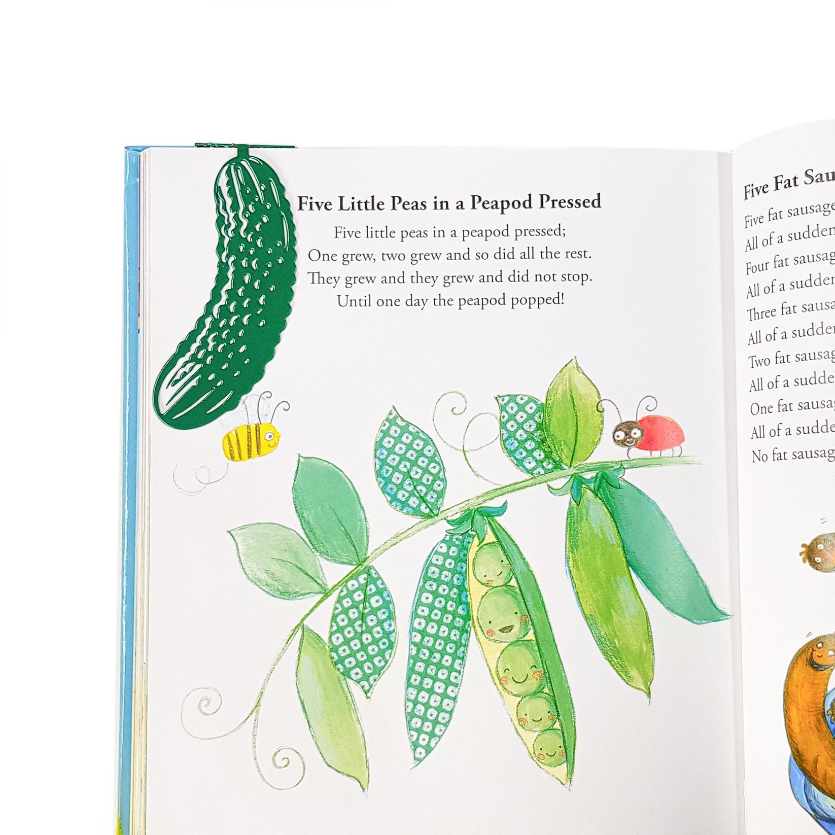 Cucumber metal bookmark in green marking a page in an illustrated book