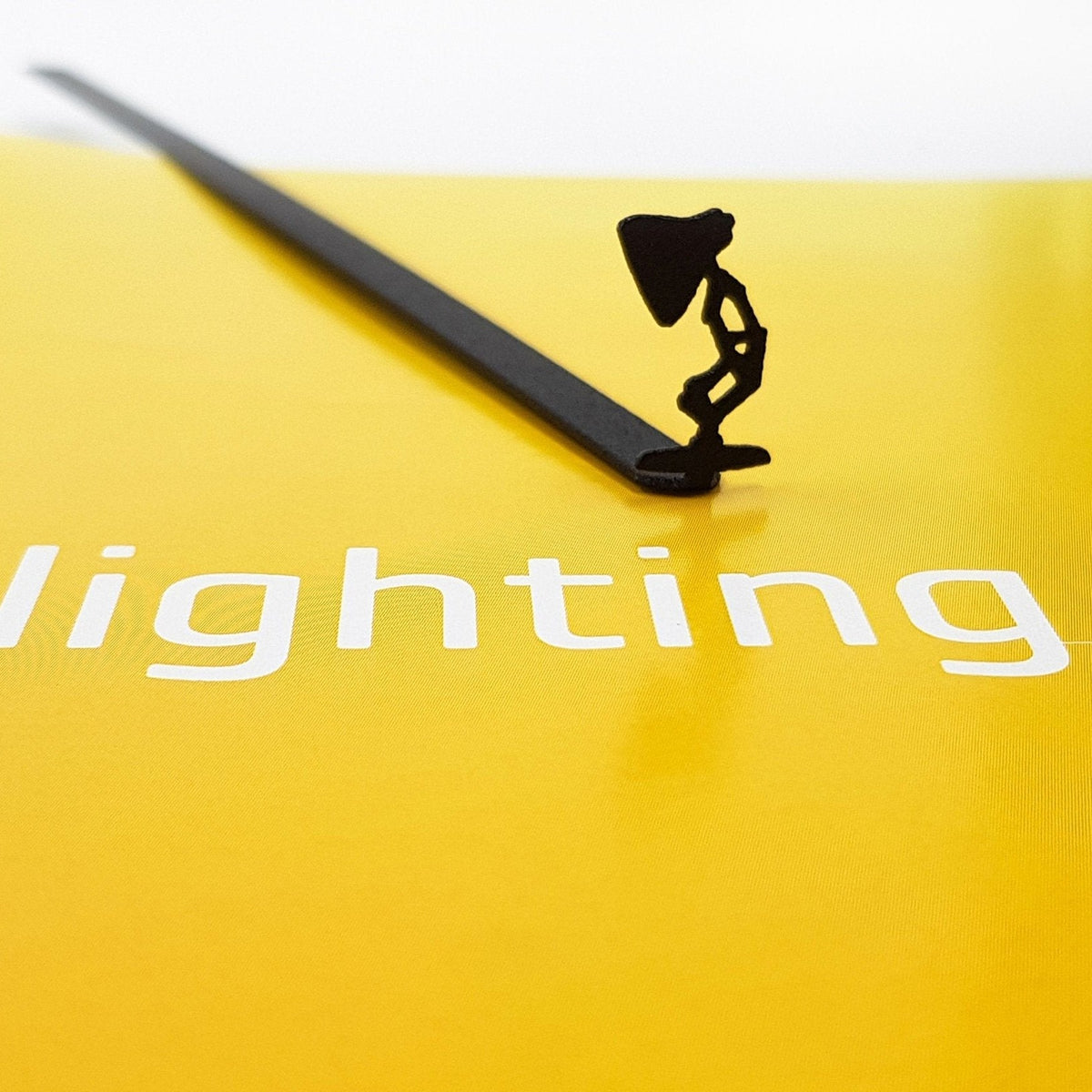 Desk Lamp metal bookmark on a coloured background