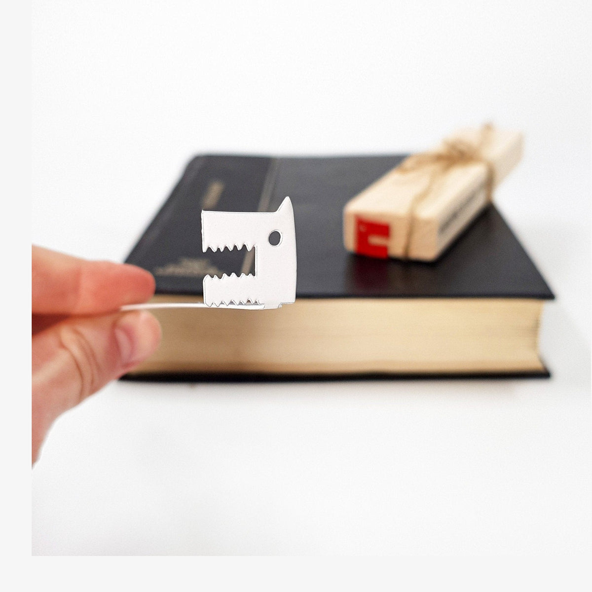 Angry Dogs metal bookmark with the engraved wooden gift block it ships with