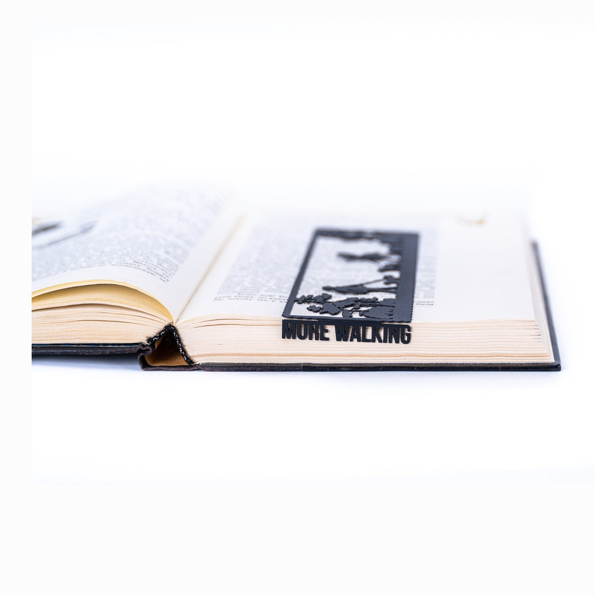 Dog Lover metal bookmark resting on the pages of an open book
