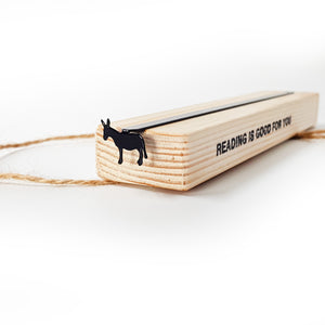 Black steel donkey bookmark tucked in wooden gift block stamped READING IS GOOD FOR YOU