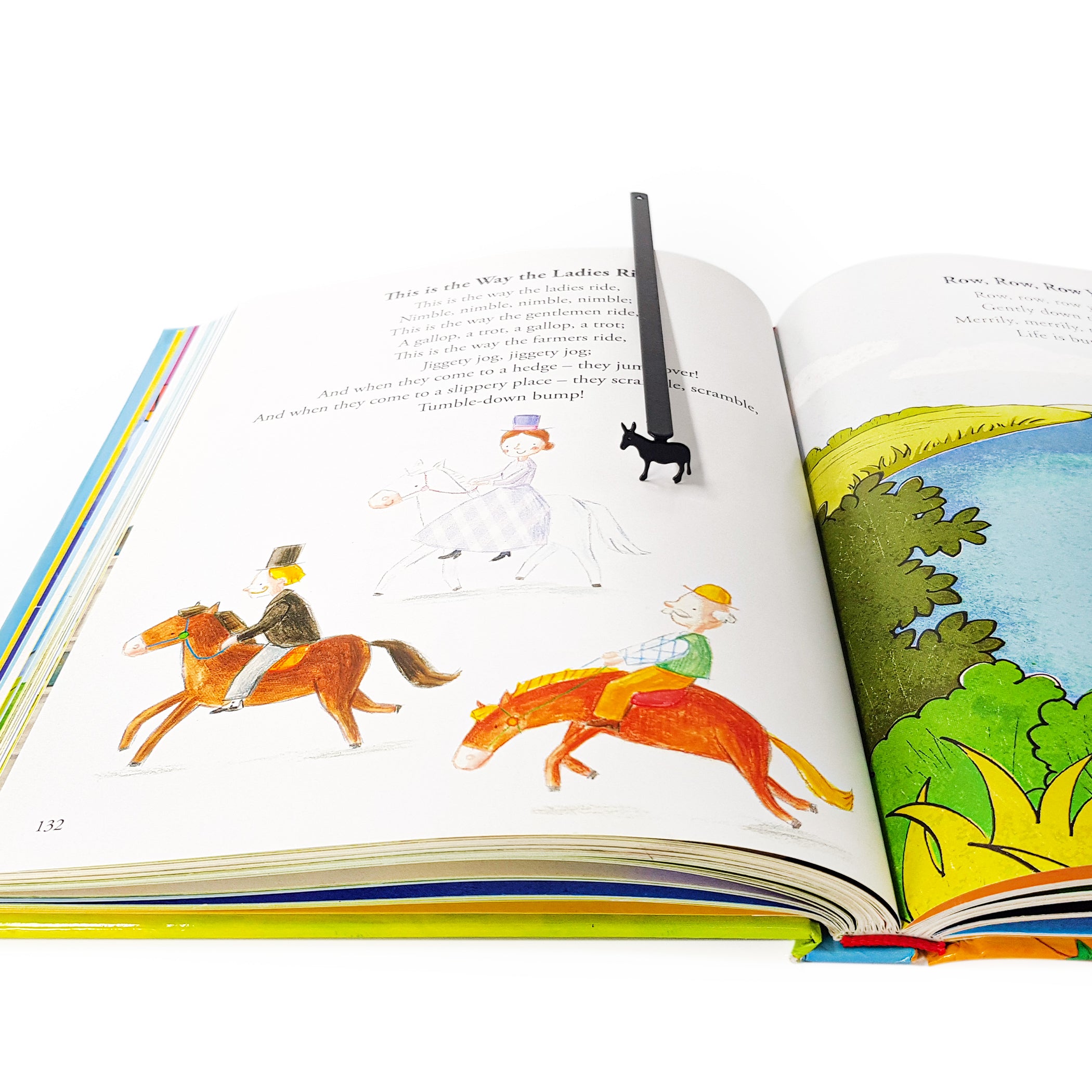 Steel donkey bookmark hanging from top of open adult book, slim profile visible