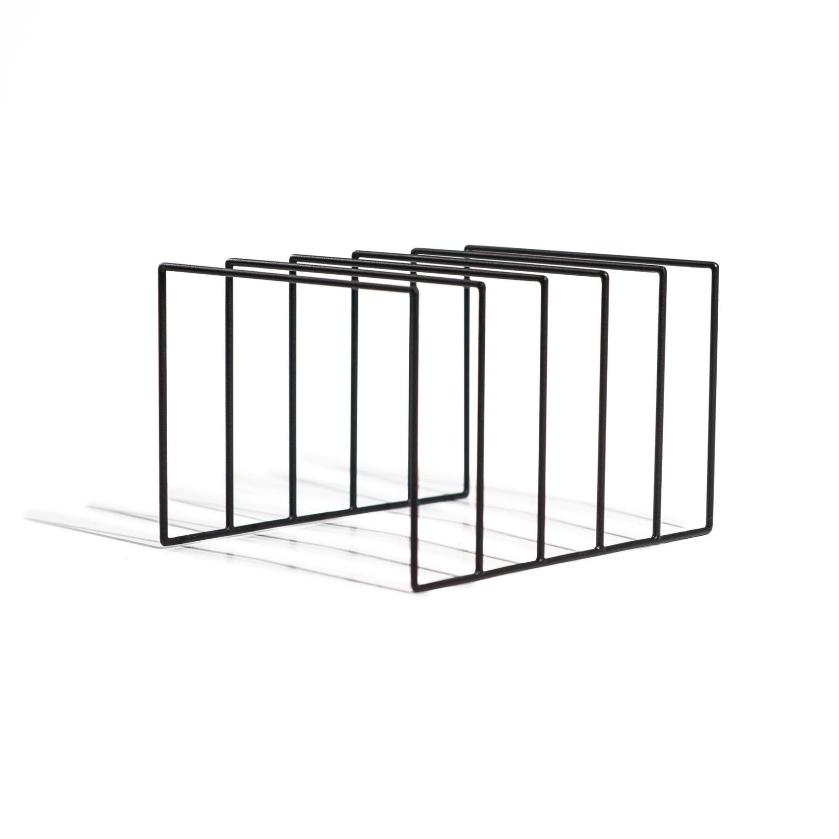 Matte black metal vinyl record holder with five evenly spaced dividers, shown on a white background. The minimalist open-frame design offers a sleek and functional way to store and display LP records vertically.