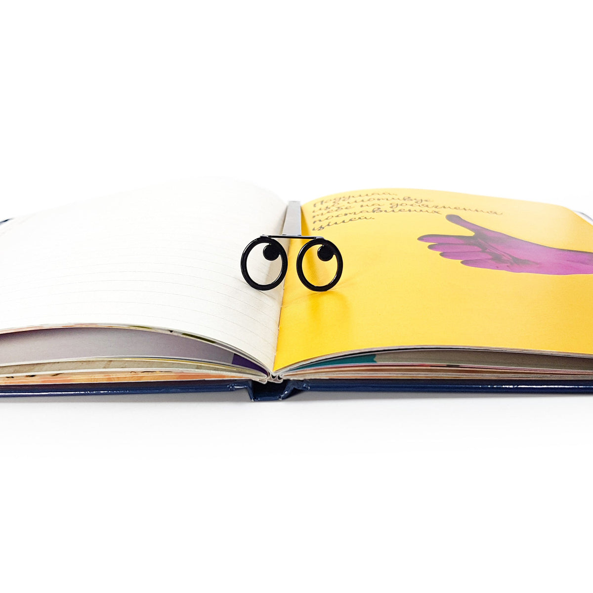 Eyes Glasses metal bookmark on an illustrated page