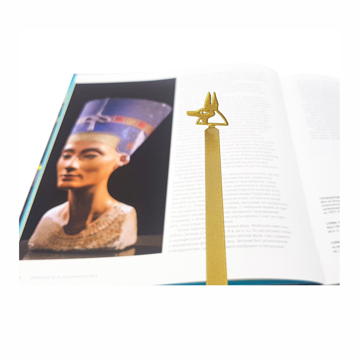 God of Death Anubis metal bookmark marking a page in an illustrated book