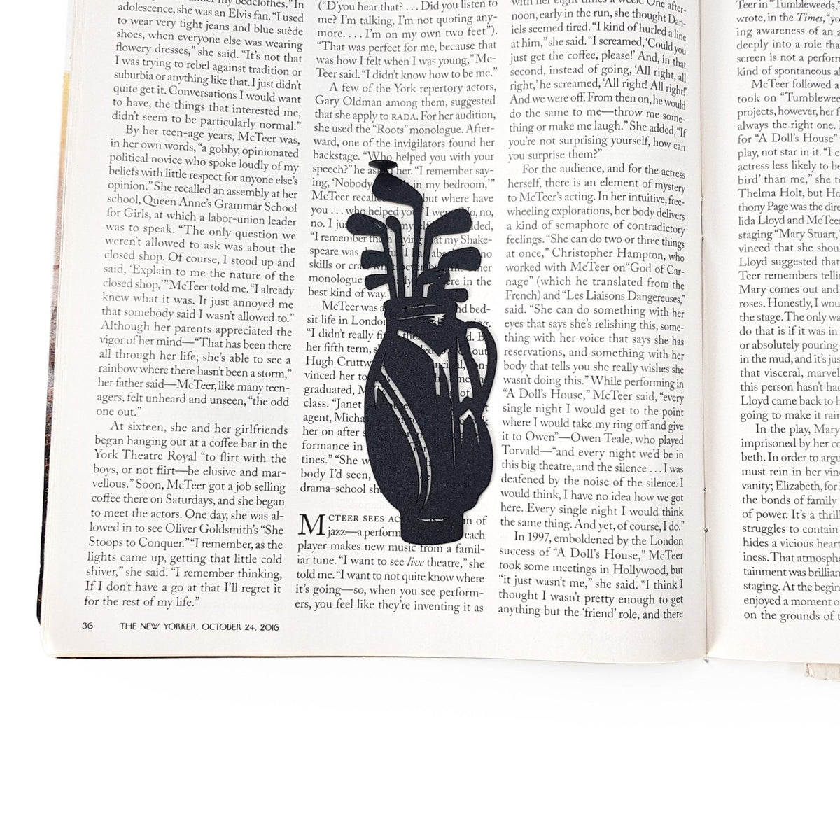 Golf Bag metal bookmark marking a page in an open book