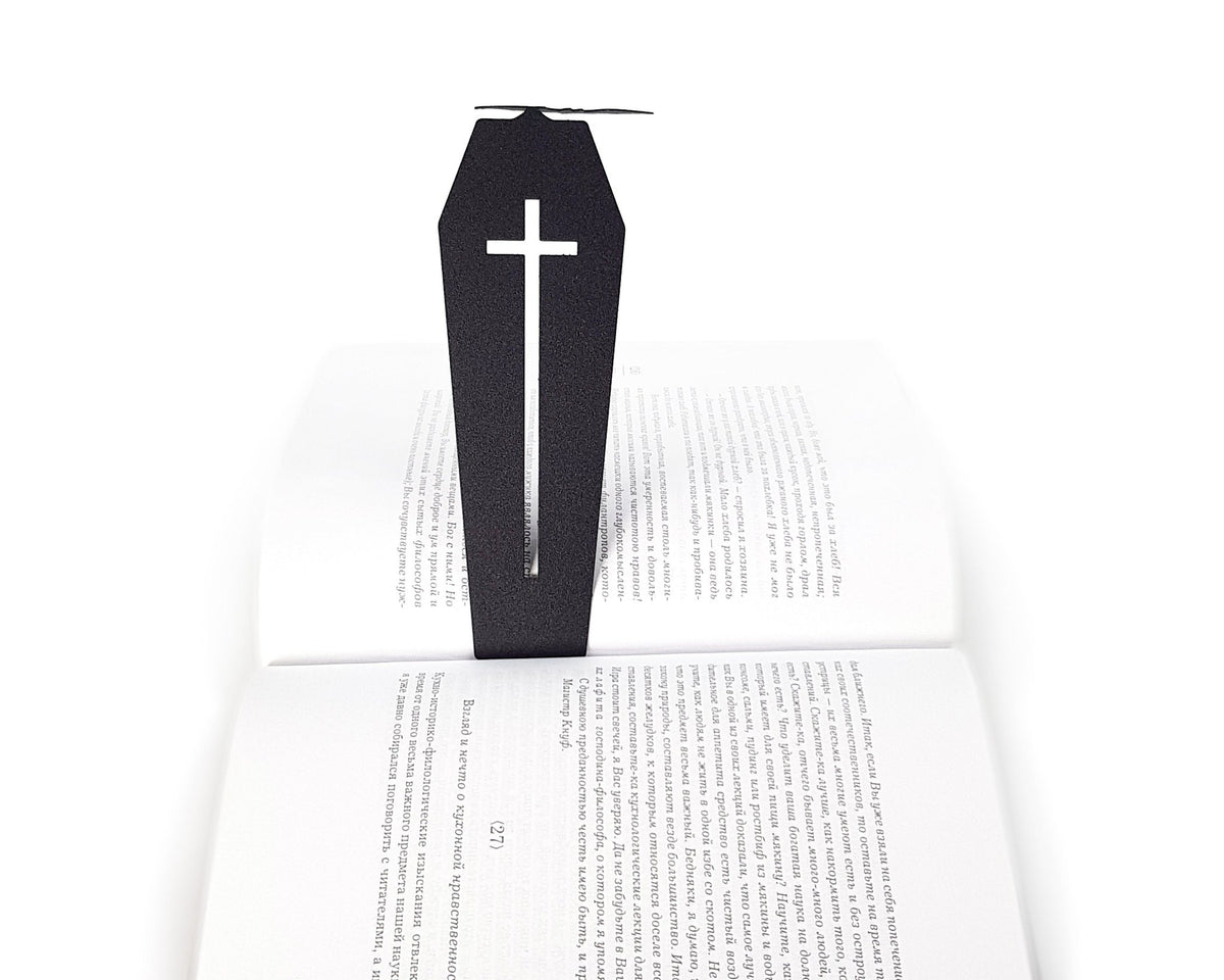 Gothic Coffin in My Book metal bookmark resting on the pages of an open book