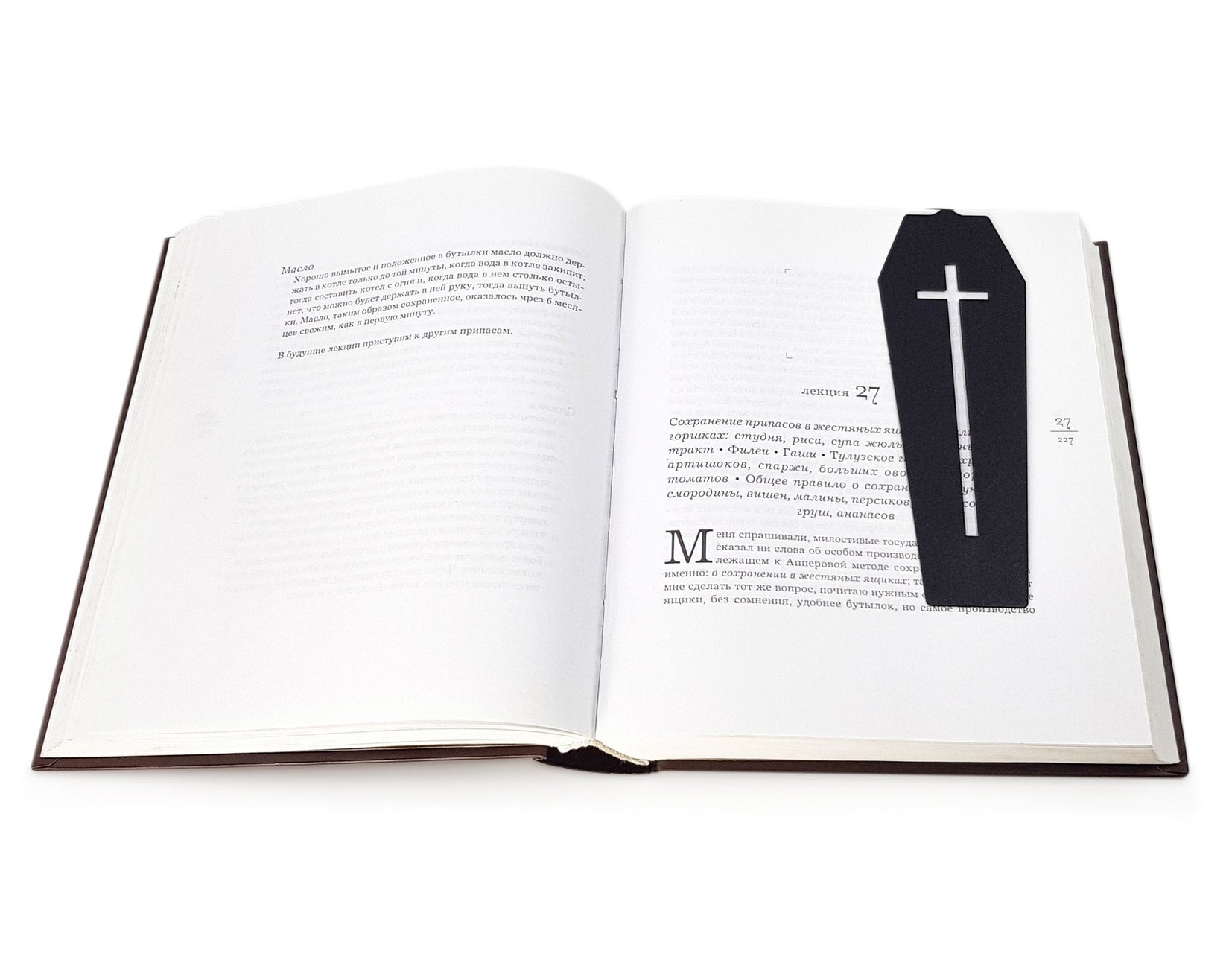 Gothic Coffin in My Book metal bookmark set into the gutter of an open book