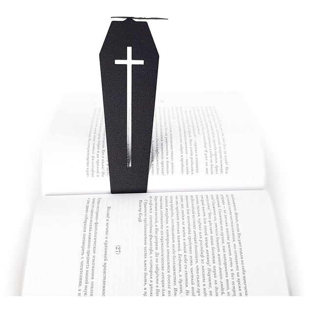 Gothic Coffin in My Book metal bookmark resting on the pages of an open book