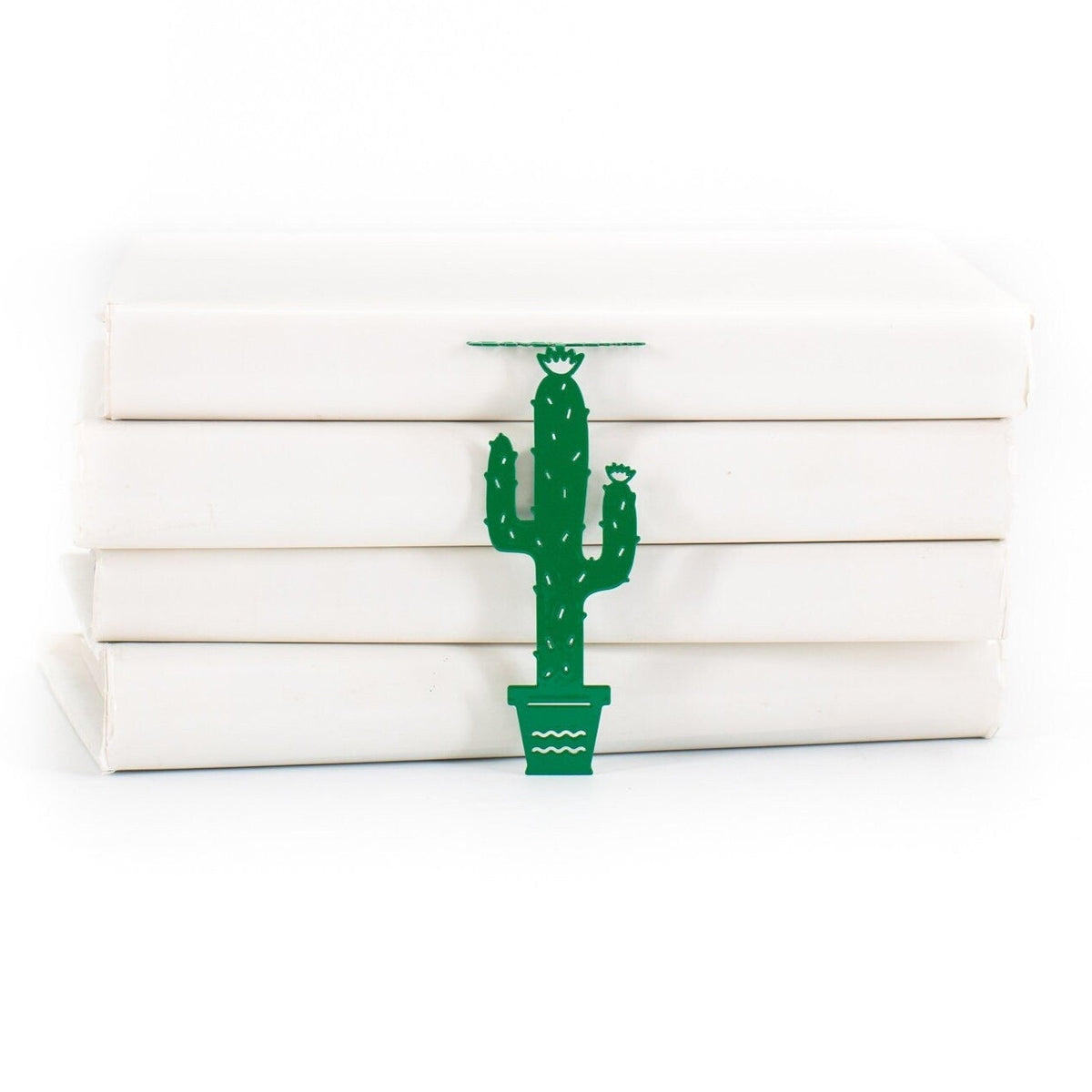 Green Cactus metal bookmark in green shown with a stack of books