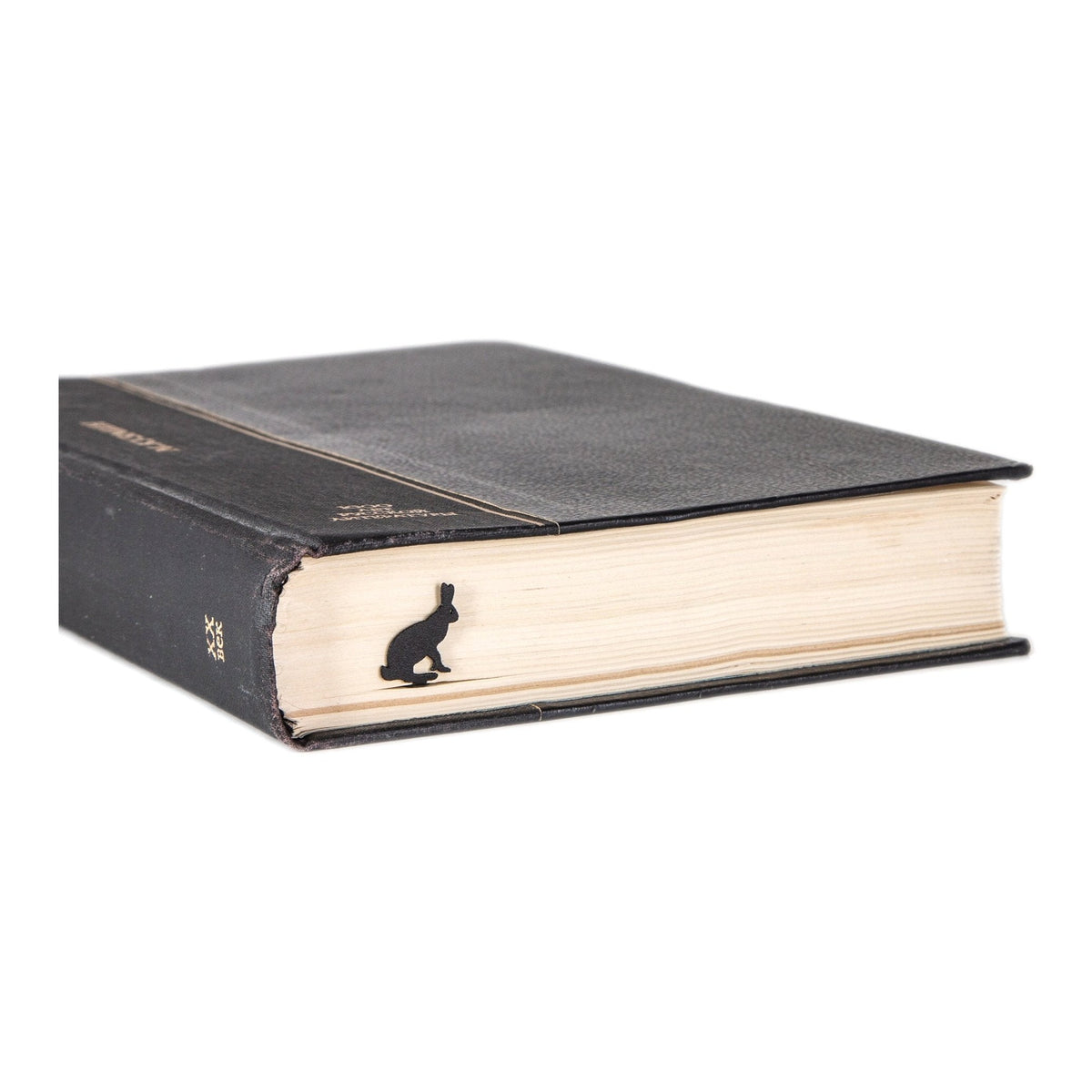 Hare metal bookmark in a closed book, only its top showing above the pages
