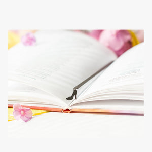 High Heel Shoe metal bookmark resting on the pages of an open book