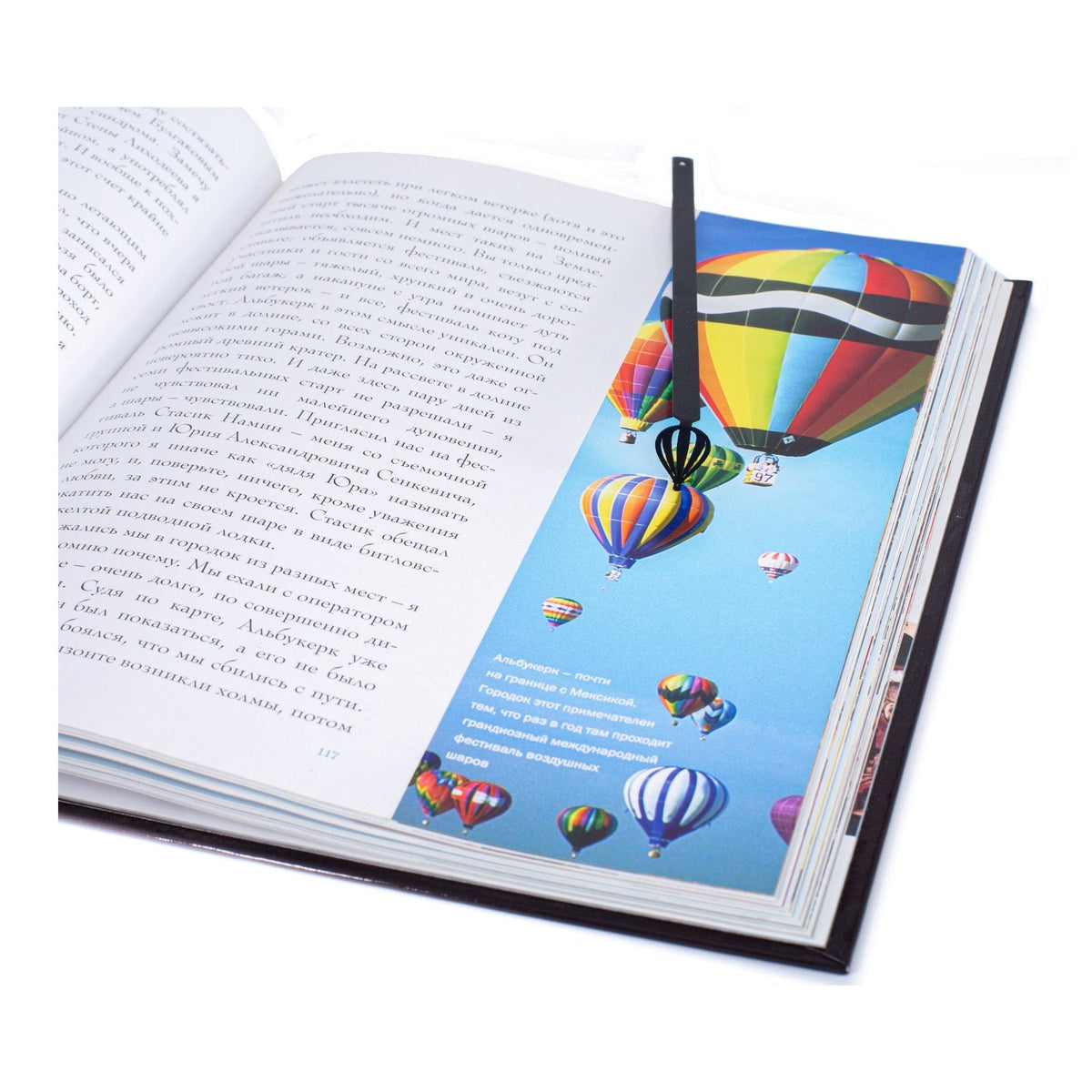 Hot Air Balloon metal bookmark marking a page in an illustrated book