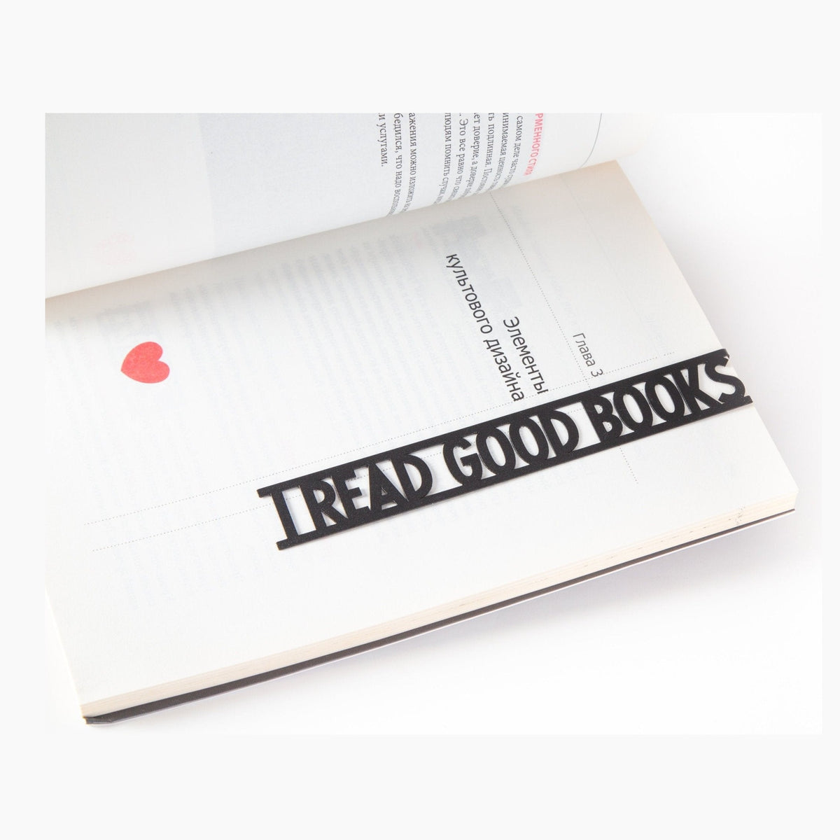 I Read Good Books metal bookmark resting on the pages of an open book