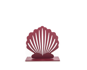 Front view of a single red metal seashell-shaped bookend with a minimalist cutout pattern, placed on a white background.