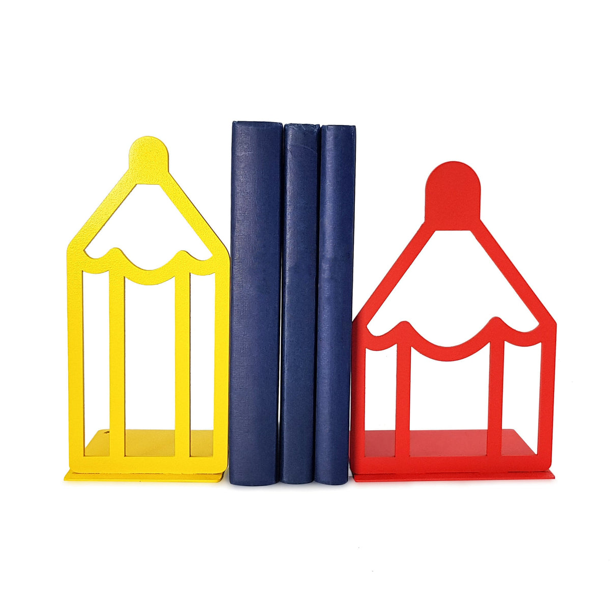 Colorful metal bookends shaped like pencils — one in yellow and one in red — holding up a set of blue books in the center. Perfect for a playful or educational setting. Designed and made by Atelier Article in Ukraine.