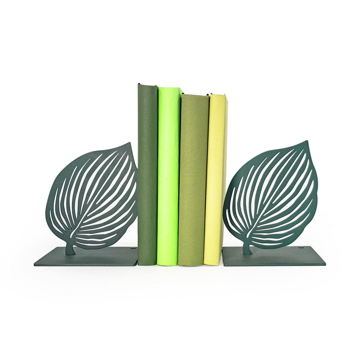 Green leaf metal bookends holding books, botanical leaf silhouette bookends with matte green finish, modern shelf decor
