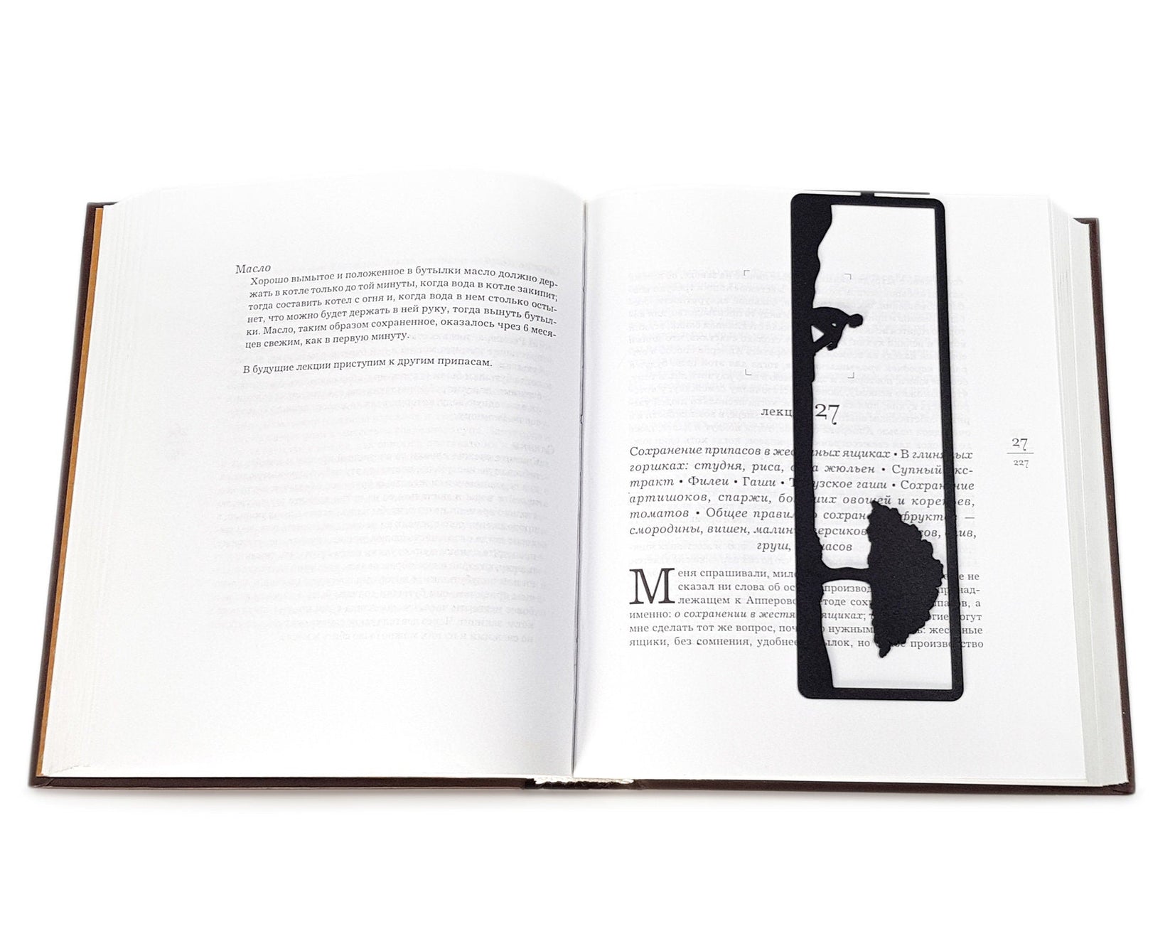 Inspirational Tranquility metal bookmark marking a page in an open book