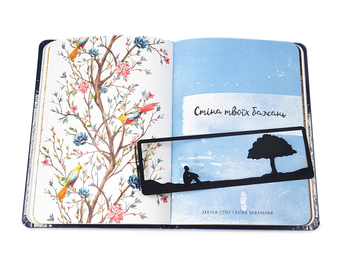 Inspirational Tranquility metal bookmark placed on a colour illustration