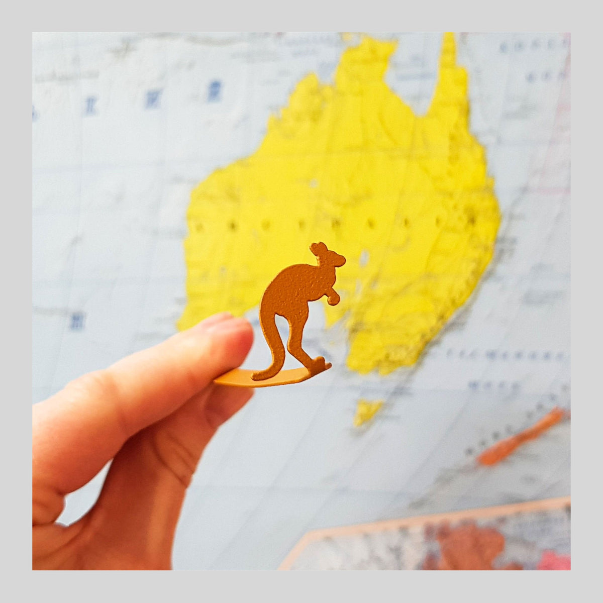 Kangaroo metal bookmark in gold on a coloured background