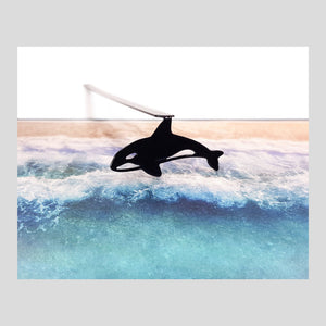 Killer Whale Orca metal bookmark marking a page in an illustrated book