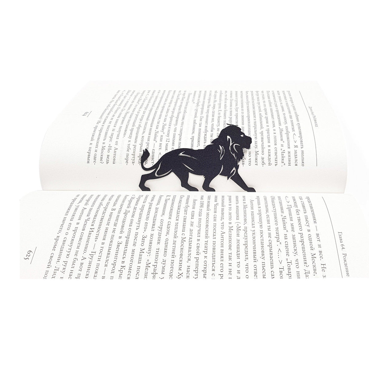 Lion, The King of Animals metal bookmark resting on the pages of an open book