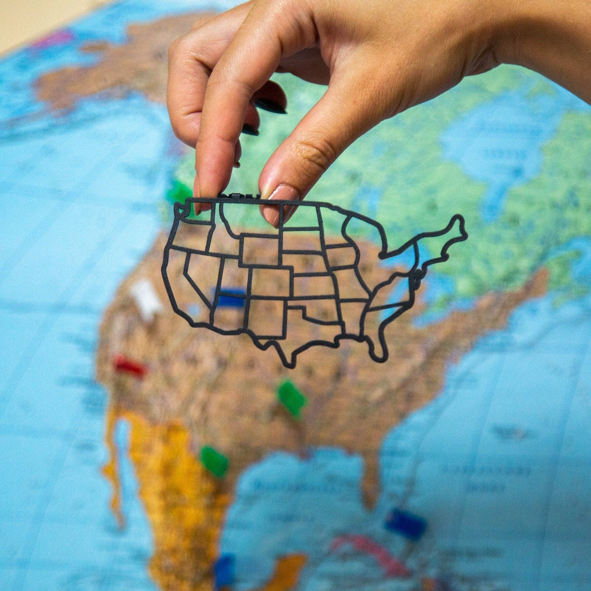 Map of USA metal bookmark on a coloured background