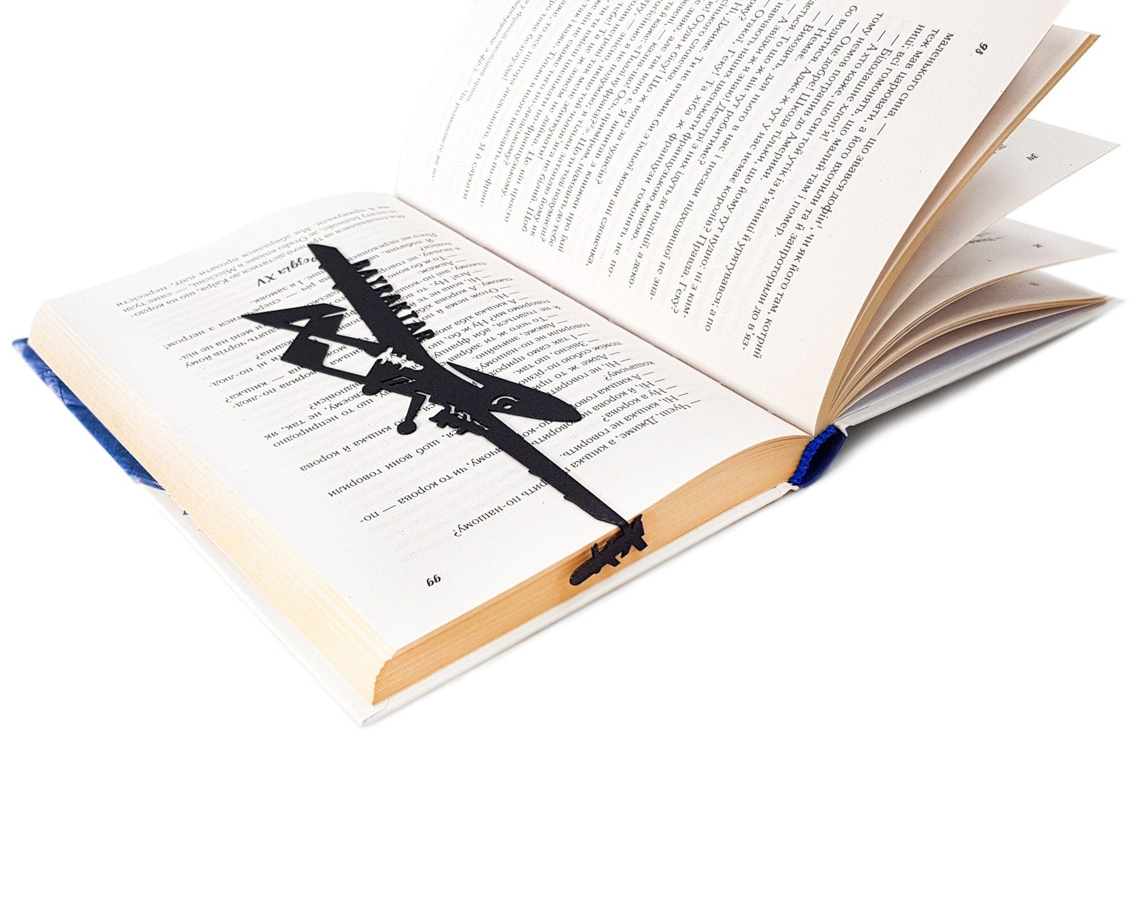 Ukraine Fights Back metal bookmark marking a page in an open book