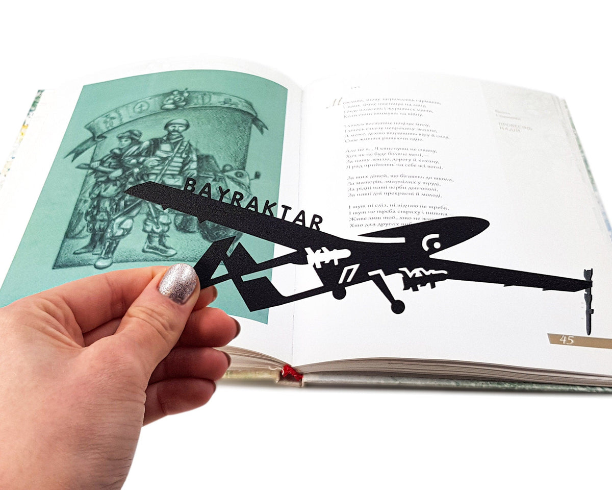 Ukraine Fights Back metal bookmark placed on a colour illustration