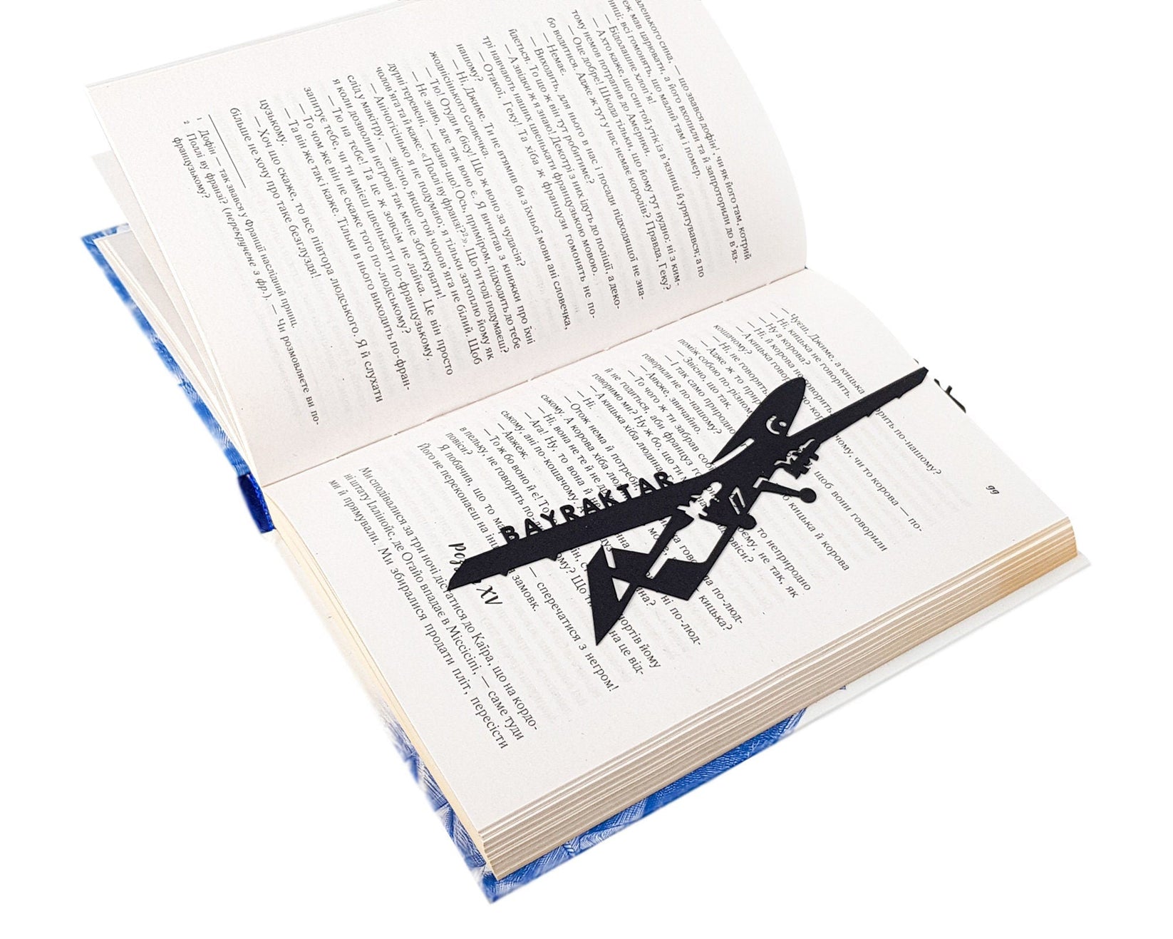 Ukraine Fights Back metal bookmark resting on the pages of an open book