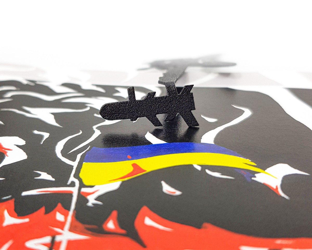 Ukraine Fights Back metal bookmark on an illustrated page