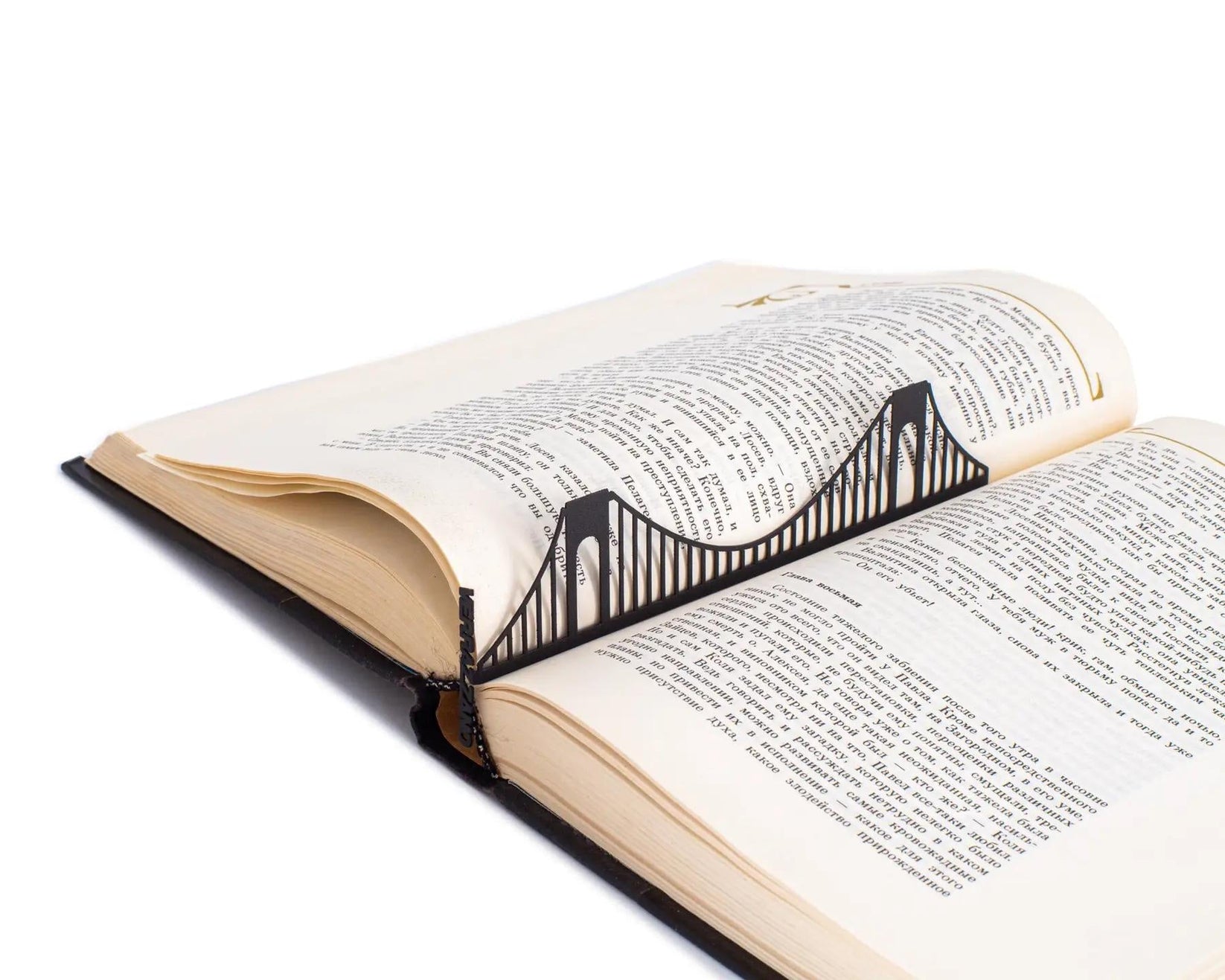 Verrazano Bridge metal bookmark marking a page in an open book