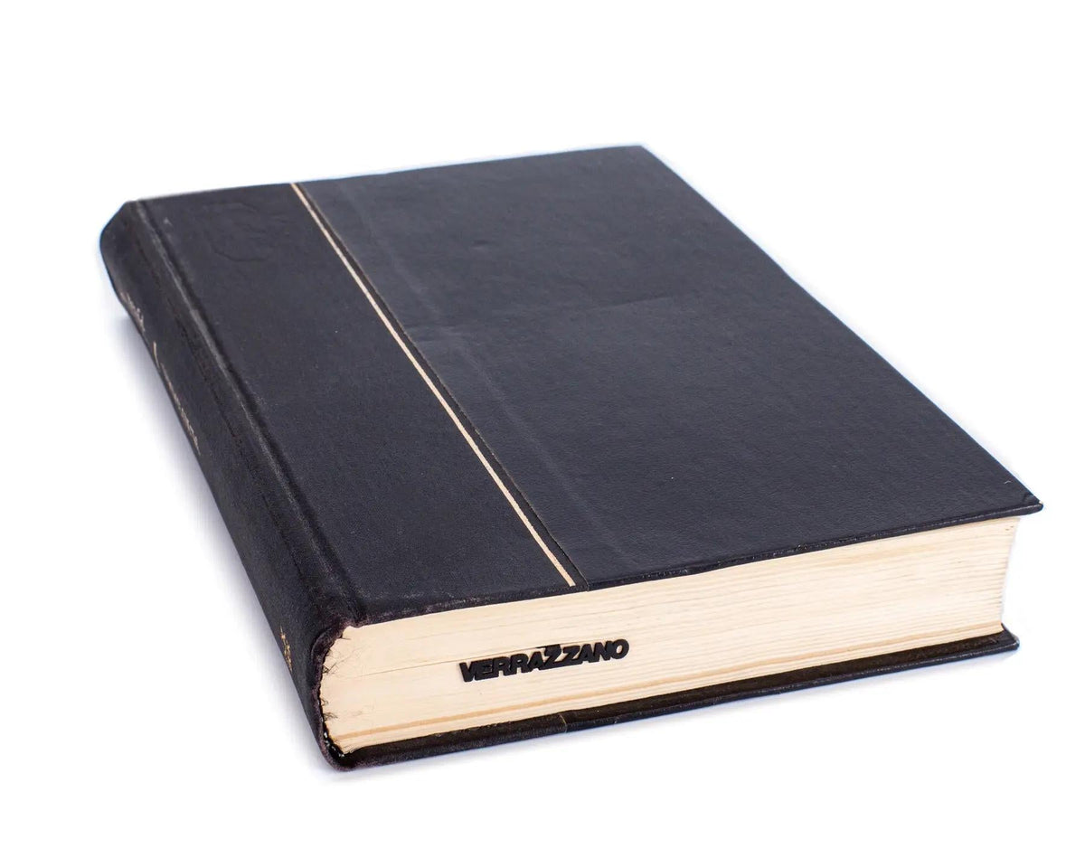 Verrazano Bridge metal bookmark in a closed book, only its top showing above the pages