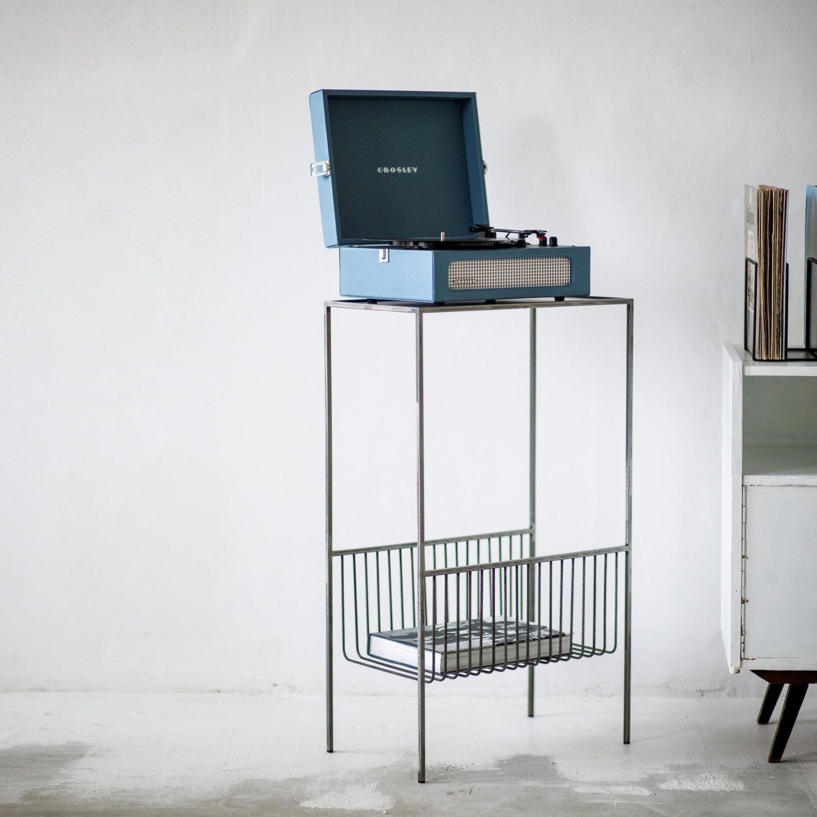 Raw steel turntable stand showing the open top and lower record storage