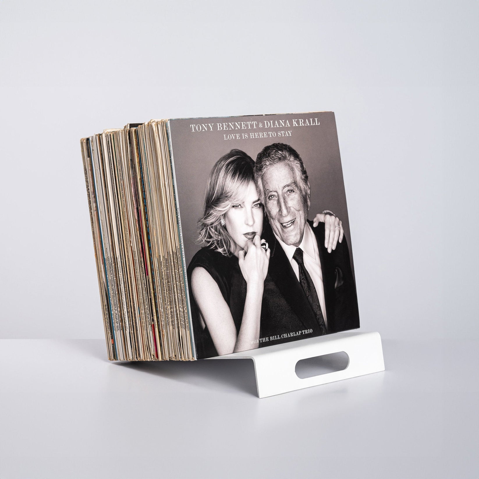 White Metal Modern LP Vinyl Record Display Stand.  with records on it.