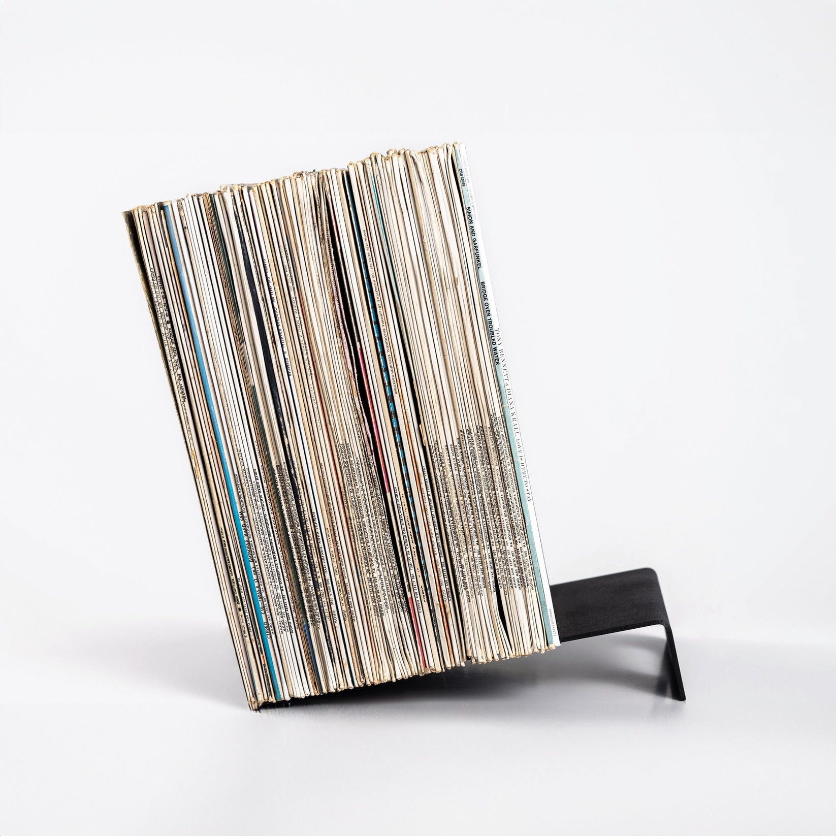 Side view of a Hand-Welded Metal LP Vinyl Record Display Stand with records on it