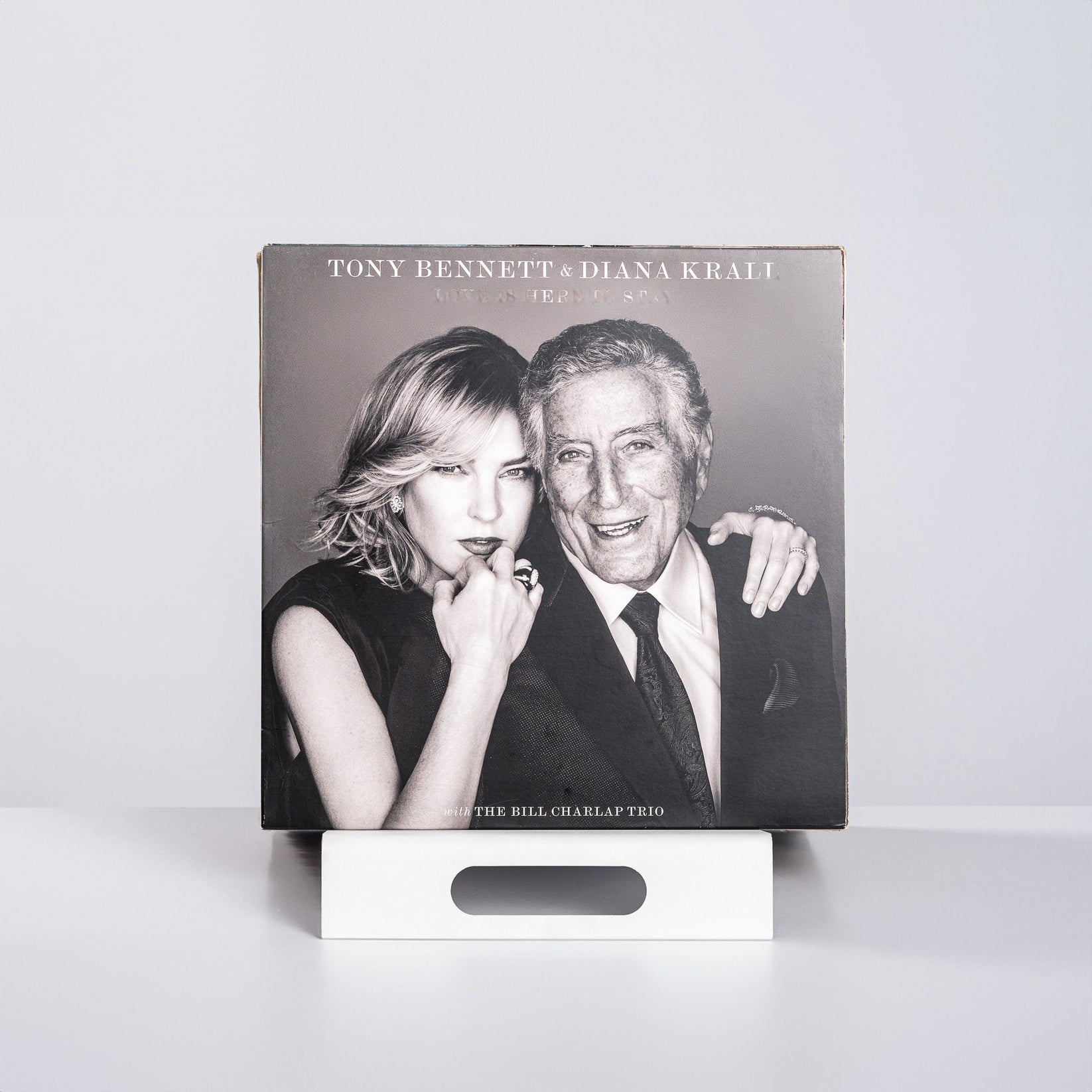 Premium Quality Hand-Welded Metal Modern LP Vinyl Record Display Stand with a record on it.