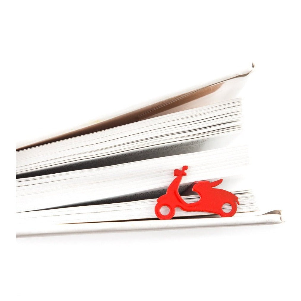 Motor Scooter metal bookmark in red resting on the pages of an open book