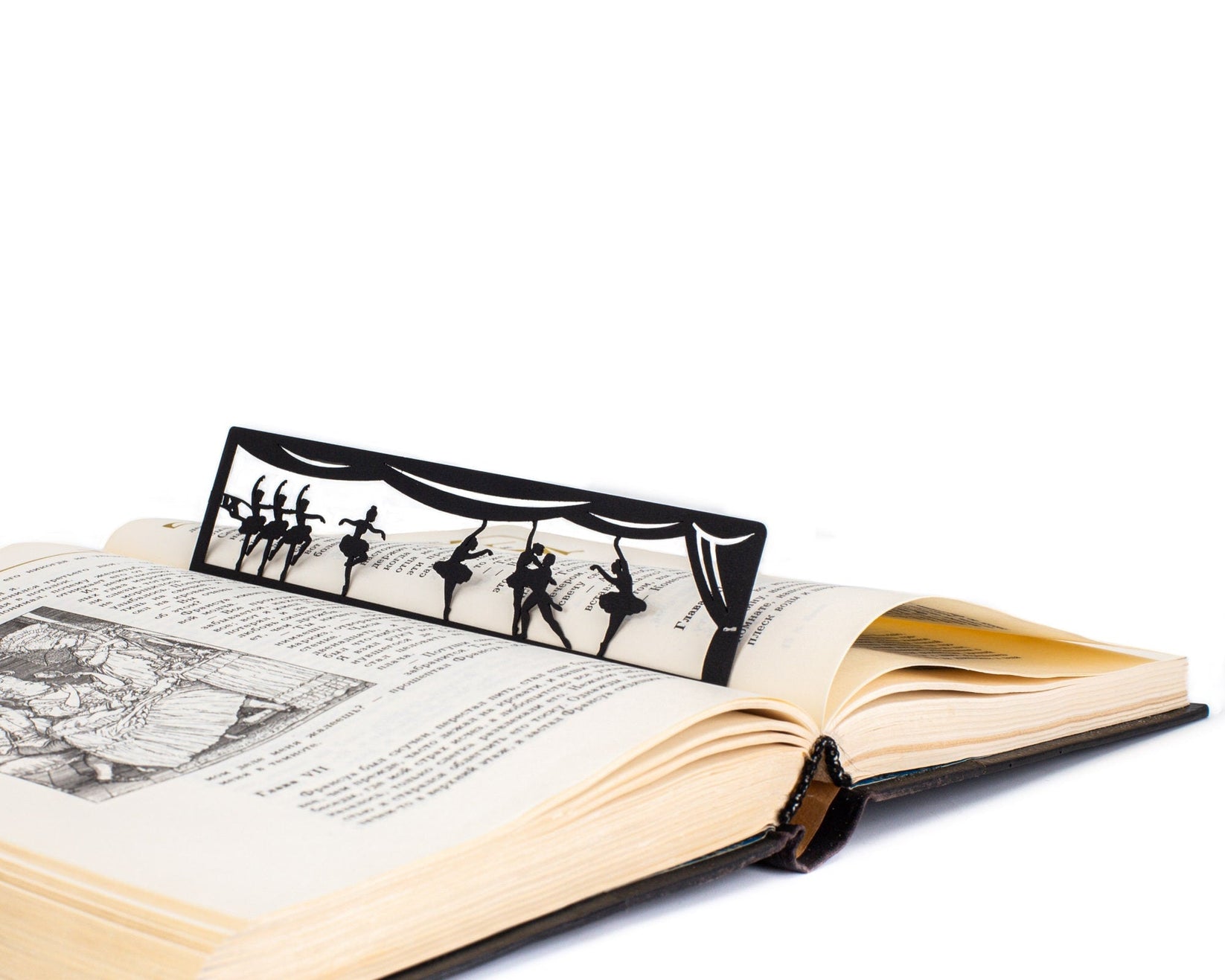 Ballet metal bookmark on an illustrated page