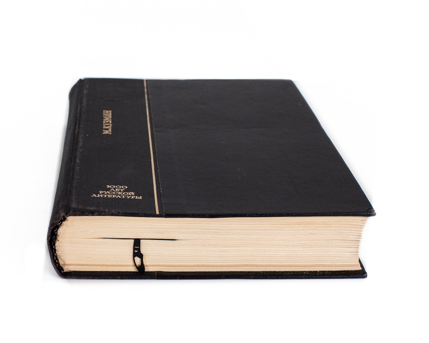 Ballet metal bookmark seen from the edge of a closed book