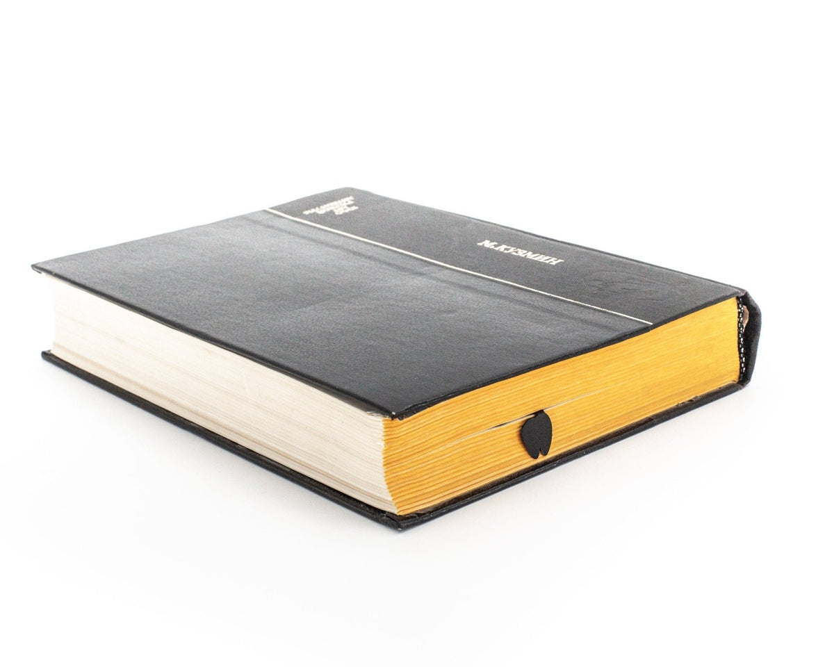 Giraffe Head metal bookmark in a closed book, only its top showing above the pages