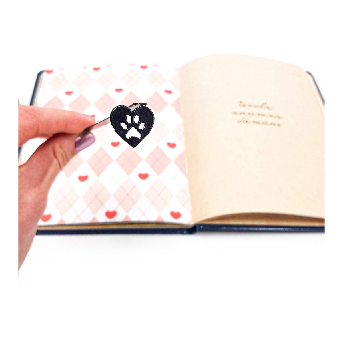 Pet Love metal bookmark on a coloured background