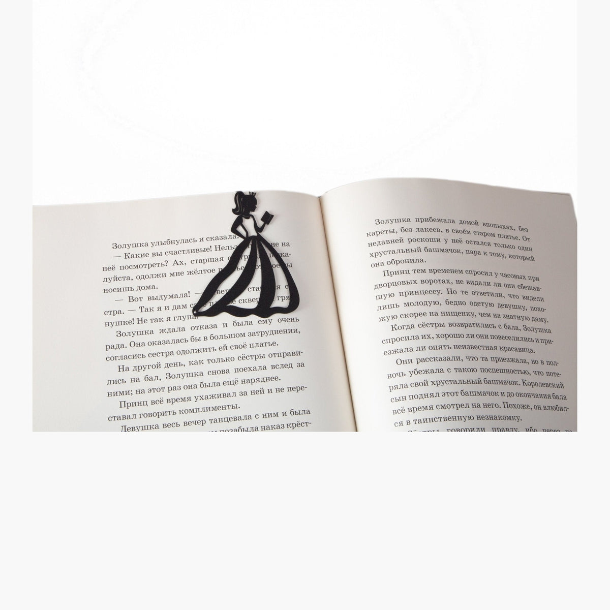Reading Princess metal bookmark resting on the pages of an open book