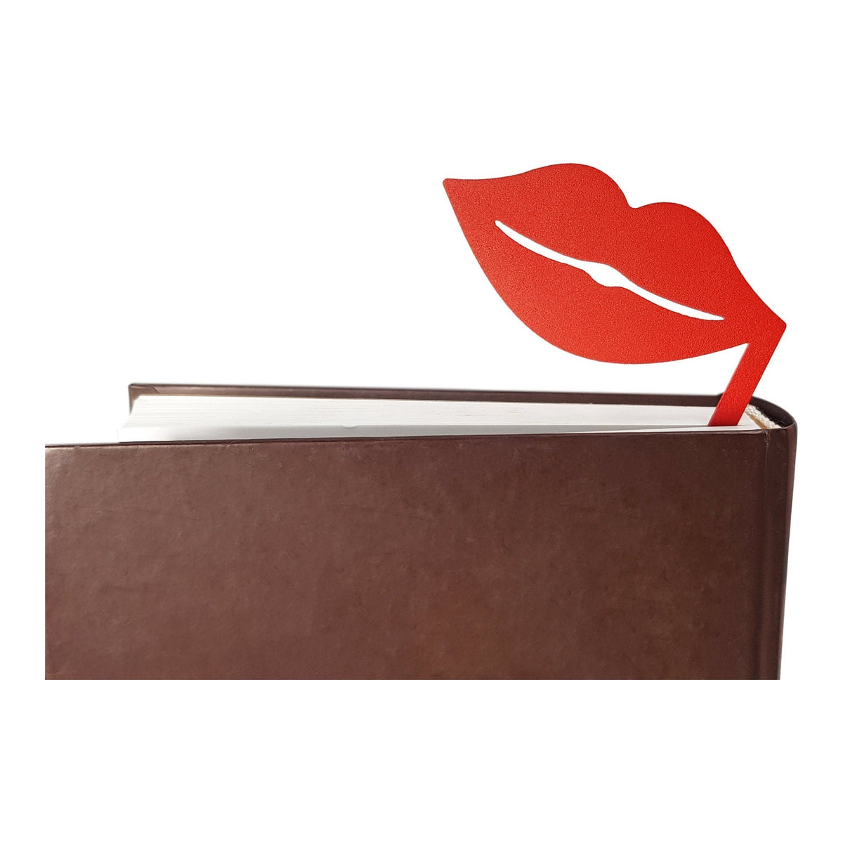 Romantic Red Lips metal bookmark in red in a closed book, only its top showing above the pages